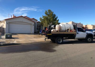 Professionally cleaned residential driveway using hot water pressure washing
