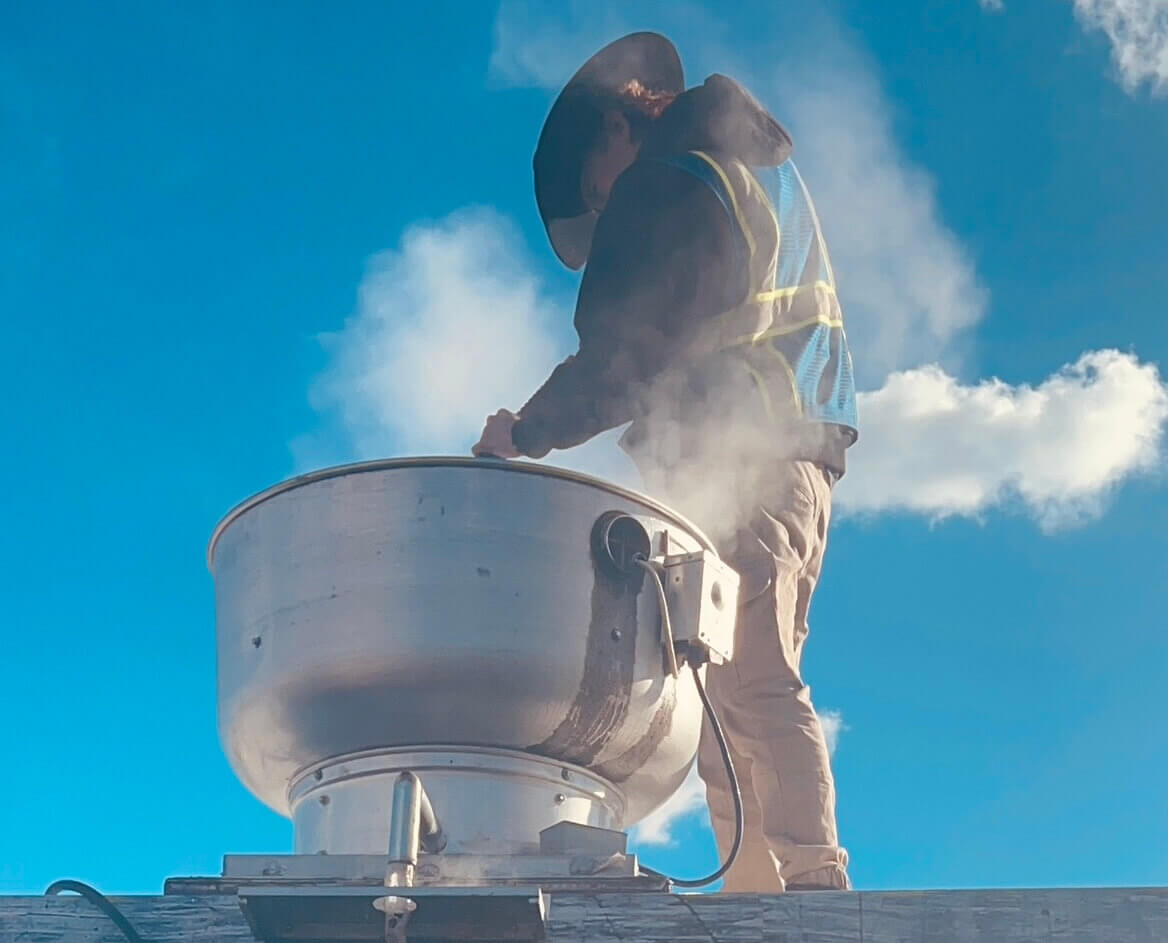 PowerWash Pro rooftop kitchen exhaust fan cleaning to ensure grease removal and fire safety compliance.