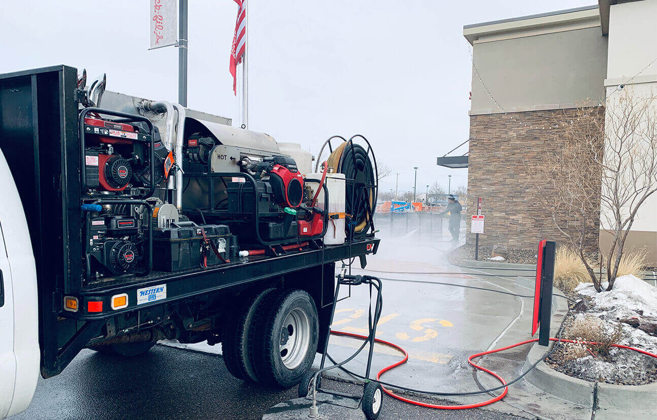 PowerWash Pro industrial-grade hot water pressure washing truck rig setup for large-scale commercial property maintenance.