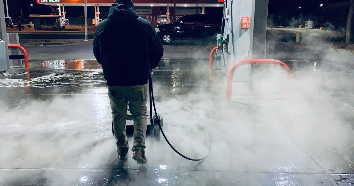 Hot water pressure washing for gas station fuel pads and canopy degreasing