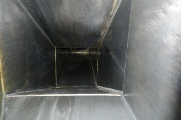 Clean commercial kitchen exhaust duct after professional hood cleaning and grease removal service by PowerWash Pro