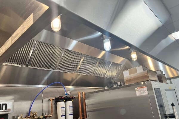 Commercial kitchen hood and baffle filter system cleaned and polished following professional hood cleaning service by PowerWash Pro